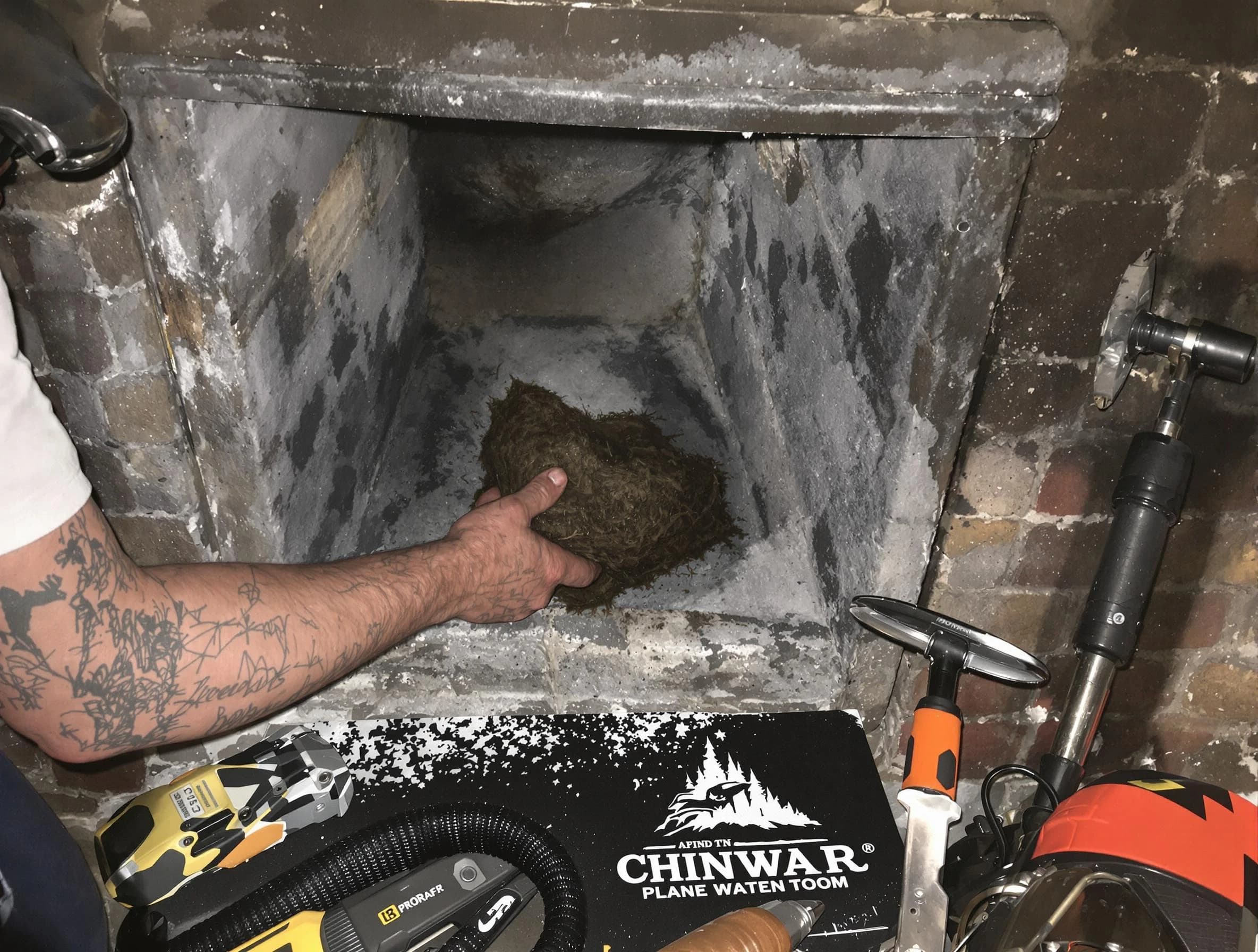 Brookline Chimney Sweep safely removing debris and screening chimney in Brookline, MA