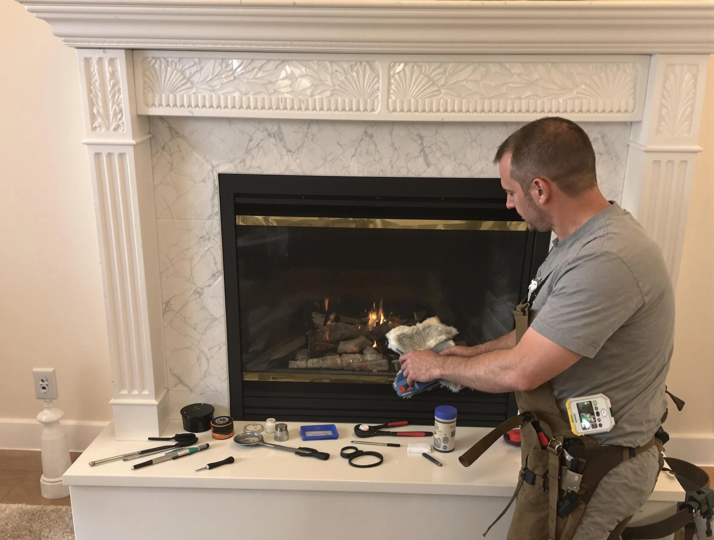 Brookline Chimney Sweep performing fireplace maintenance in Brookline, MA